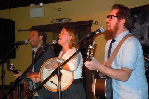 2908-The Once, l-r, Andrew, Geraldine Hollett and Phil Churchill pumped up the capacity crowd on March 16 at Sharbot Lake's Crossing Pub